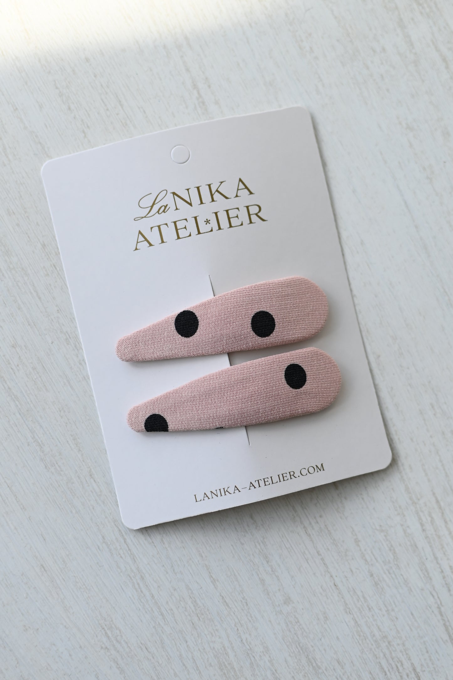 Baby pink with black dots